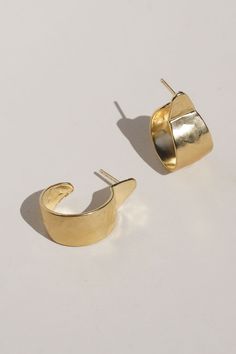 Sleek and sophisticated, classic and timeless, these hoop oval earrings are perfect for day or night. The hammered texture catches the light and the simple style adds a bold pop. Gold Vermeil (14k gold over sterling silver) made with recycled materials. CARE: Most metals will naturally patina over time, however, there are measures you can take to prolong the life of your jewelry. We recommend removing all jewelry prior to showering, swimming, cleaning, or applying lotions or oils. If your jewelr Modern Gold Hammered Hoop Earrings, Gold Hammered Oval Hoop Earrings, Gold Oval Hammered Hoop Earrings, Minimalist Everyday Hammered Huggie Earrings, Everyday Minimalist Hammered Huggie Earrings, Modern 14k Gold Hammered Hoop Earrings, Gold Hammered Hoop Earrings, Hammered Hoop Earrings, Oval Earrings