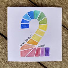 a card with the number two painted in different colors on it, which reads happy birthday today