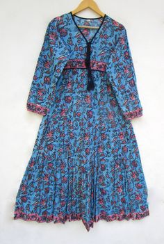 "ITEM DESCRIPTION blue and pink flower look print women maxi dress - v neckline with tassel maxi dress - long sleeve boho maxi dress Features: Long sleeve, V neck, Long dress Material: Cotton cambric Fabric: 100% cotton soft light weight ethnic print fabrics  Sleeve Length = 22 inch For more sizes & their measurement, please refer our below chart to understand the sizes variations available with us For your size requirement, please mention your size in seller note at the time of buying. SIZE MEASUREMENT  BUSTLENGTHSHOULDER XXS34 inch51 inch13.5 inch XS36 inch51 inch14 inch S38 inch51 inch14.5 inch M40 inch51 inch15 inch L42 inch51 inch16 inch XL44 inch51 inch16.5 inch 2XL46 inch51 inch17 inch 3XL48 inch51 inch18 inch   Company Return Policy:  Please write for more information to my email d Spring V-neck Maxi Dress With Back Tassel Tie-up, Spring Maxi Dress With Back Tassel Tie-up, Spring Boho Maxi Dress With Back Tassel Tie-up, Spring Boho Print Long Maxi Dress, Blue Floral Print Maxi Dress For Festival, Long Maxi Dress With Tassels, Long-sleeved Flowy Dress With Tassels, Long Blue Floral Print Boho Dress, Flowy Long Sleeve Dress With Tassels