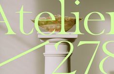 an advertisement for ateliern's 78th anniversary celebration featuring a salad on a pedestal