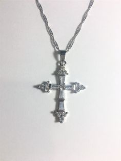 "Beautiful Tanzanite Cross Pendant Necklace, Tanzanite & CZ Cross Pendant Necklace 18\" White Gold Plated Wave Chain. The Cross pendant has White Topaz and Clear Cubic Zirconia. The Cross is 1 1/2\" High x 1\" Wide Please ask any questions as I do not accept returns.. Thank You !" Silver Spiritual Necklace With Cubic Zirconia, Spiritual Cubic Zirconia Necklaces With Diamond Accents, Spiritual Silver Necklace With Cubic Zirconia, Spiritual Silver Cubic Zirconia Necklace, Diamond White Crystal Cross Pendant Jewelry, Diamond White Cubic Zirconia Necklace With Stones, White Crystal Cross Necklaces, Crystal Jewelry With Diamond Accents, Cross Pendant, Silver Cubic Zirconia Necklace With Stones