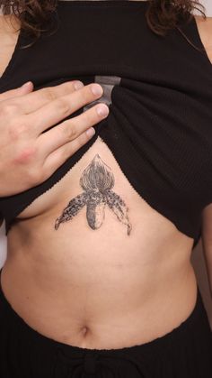 a woman with a tattoo on her stomach