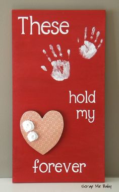 a red sign with two hand prints and a heart on it that says, these hold my forever