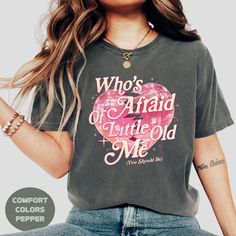 "Get ready to make a bold statement with our 'Who's Afraid of Little Old Me' tshirt! Perfect for fans who love a mix of confidence and style, this shirt is a must-have. Whether you're at a concert or just rocking it casually, this shirt is ideal for anyone who isn't afraid to stand out. It also makes an amazing Christmas gift for girls, teens, moms, or girlfriends. Whether you're shopping for a Tay fan or just someone who loves unique fashion, this tee will quickly become a favorite. Show off yo Poets Shirt, Poet Shirt, Pop Pop Shirts, Indie Pop, Concert Shirts, Family Christmas Shirts, Fan Shirts, Gift For Girls, Mens Long Sleeve Tee