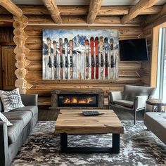 a living room filled with furniture and a fire place in front of a painting on the wall