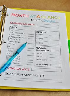 a planner with a pen on top of it