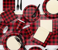 red and black plaid table cloth with place settings, napkins and utensils