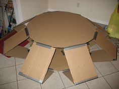 several cardboard boxes stacked on top of each other in the middle of a kitchen floor