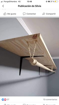 an upside down wooden shelf in a room