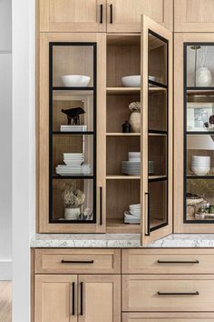 the cabinets in this kitchen have glass doors