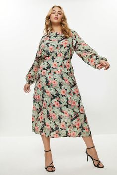 When the occasion calls for a dash of drama, reach for this luxe floral-print dress. Fitted with a sweeping cape that ripples as you walk, this open-backed beauty shows off your bold side in style.Expertly designed for those size 18 and above, our plus size collection is perfectly proportioned to ensure you look stylish at every shape.Style: DressDesign: FloralFabric: GeorgetteLength: MidiNeckline: Round NeckSleeve Length: Long Sleeve Ladies Day Dresses, Dresses Plus Size, Dress Fitted, Leopard Print Dress, Black Midi Dress, Floral Print Dress, Dress Collection, Day Dresses, Plus Size Dresses