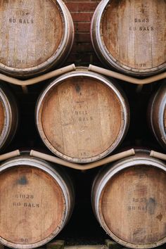 several wooden barrels stacked on top of each other