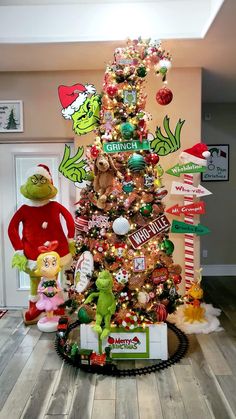 the grinch christmas tree has been decorated with many different ornaments and decorations on it