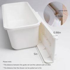 an image of a white sink with measurements for the bottom and side drawers on it