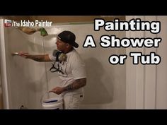 a man is painting a shower or tub in his bathroom with the words, painting a shower or tub