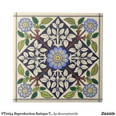 an artistic tile design with blue flowers and green leaves on white ground, in the shape of a flower