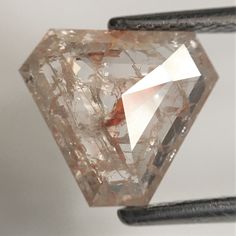 a close up of a diamond on a wire