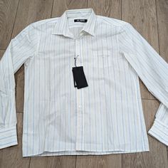 Sizes: 48 Us Medium 50 Us Large Color: White From The Spring '23 Collection Comes This Look-Back Button-Up Tailored From Cotton, Subtly Striped And Marked With A Vintage-Look Raf Simons Label At One Cuff. Front Button Closure Spread Collar Long Sleeves With Two-Button Cuffs Chest Patch Pocket 100% Cotton Machine Wash, Line Dry Made In Italy Retail Price $690 Formal Yellow Cotton Shirt, Yellow Formal Shirt For Spring, Formal Yellow Shirt For Spring, Spring Formal Yellow Shirt, Spring Yellow Formal Shirt, Yellow Spread Collar Shirt For Work, Raf Simons Shirt, Perry White, Raf Simmons