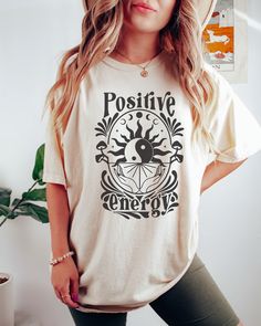 PLEASE NOTE, DUE TO THE BUSY HOLIDAY SEASON ANY ORDERS PLACED AFTER 12/09/24 ARE NOT GUARANTEED TO ARRIVE BY CHRISTMAS.Comfort Colors Shirt Positive Energy Shirt Moon Phases Graphic Tee Yoga Shirt Meditation TShirt Spiritual T-shirt Women's T-shirts Oversized Comes in multiple colors! Check out more designs here: www.etsy.com/shop/jadeandroseshop ✨️SIZE AND FIT: Your shirt will be printed on a high-quality, soft and comfortable unisex t-shirt. Sizes run true to size, which takes the guesswork ou Spiritual Shirts, Yoga Tees, Yoga Shirt, Fall Tee, Yoga Tshirt, Comfort Colors Shirt, Spooky Vibes, Orange Shirt, Yoga Shirts