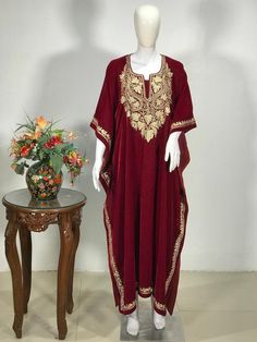 A stunningly marvellous Kaftan. This Kaftan features Kashmir tilla embroidery all around the kaftan borders.- - - - - - - - - - - - - - - - - - - - Product Details- Condition: Brand New (made to order)- Style: Kaftan- Fabric: Fine Micro Velvet- Base Colour: Red- Embroidery: Tilla Work- Embroidery Colour: Gold- Standard Length: 42" - Care Instructions: Dry Clean Only**If you want the kaftan to be shorter or longer, just send us a message, and we will tailor it accordingly.Sizing- Please select yo Long Kaftan With Gold Embroidery For Festivals, Bohemian Gold Kaftan With Zari Work, Festive Kaftan With Gold Embroidery For Festivals, Gold Bohemian Kaftan With Zari Work, Festive Gold Embroidered Kaftan For Festivals, Red Dress With Gold Embroidery For Eid, Festive Gold Thobe For Festivals, Bohemian Ceremonial Kaftan With Zari Work, Long Kaftan With Gold Embroidery For Festive Season