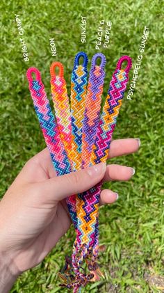 a person holding up some colorful items in their hand with the words on it and two different colors