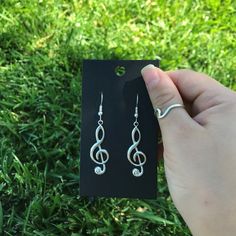 These are great to gift to musicians, those in choir, music teachers or those who simply love music.  With these treble clef silver earrings, you can wear your passion for music on your ears! Or simply gift these!  They're lightweight and easy to put on, and they'll look great with any outfit. They're also handmade by me so you know they're super special. You can wear them every day as a reminder that you love music, or you can give them as a gift to someone who loves music. These earrings and handmade with love!🤍 **CAN REQUEST OTHER EARRING HOOKS** Music Note Earrings, Music Earrings, Choir Music, Music Teachers, Musician Gifts, Treble Clef, Love Music, Music Note, Earring Hooks