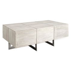 a white table with two black legs and one is made out of wood, the other has