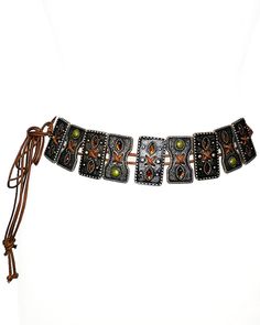 This tie belt is made with unique, embellished slider ornaments with Olive and Topaz colored stones on a brown cotton rope. 52" Full length One size adjustable Acrylic stones Imported Brown Adjustable Festival Jewelry, Brown Adjustable Jewelry For Festivals, Bohemian Adjustable Belts For Summer, Elegant Adjustable Belts For Festivals, Elegant Festival Belts, Adjustable Belts For Summer Festival, Brown Adjustable Length Jewelry For Beach, Adjustable Bohemian Summer Belts, Brown Adjustable Length Jewelry For The Beach