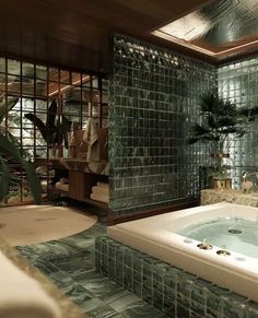 a bath room with a jacuzzi tub and tiled walls