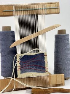 two skeins of yarn sitting next to each other on top of a table