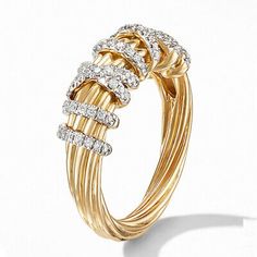 a gold ring with three rows of diamonds