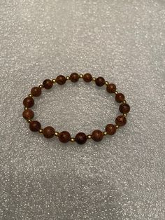 Men's stretchable 8 in. 8 mm brown wood round beaded bracelet Cheap Brown Jewelry, Wood Brown Aesthetic, Cute Brown Accessories, Wood Beaded Jewelry, Cheap Brown Circular Jewelry, Brown Bracelet Aesthetic, Wood Bead Ideas, Brown Beads Bracelet, Brown Jewelry Aesthetic