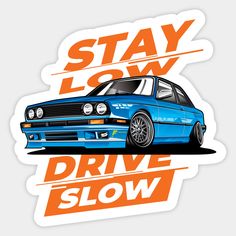 a sticker with the words stay low drive slow in front of a blue car