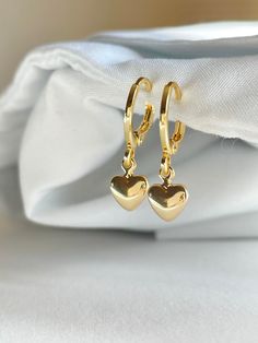 handmade 18k gold plated heart huggies (free shipping) - earring hoop diameter: 14mm - hypoallergenic - 18k gold plated - tarnish resistant 💗 30% of profits donated 💗 ships in environmentally friendly packaging 💗 comes with a free sticker 💗 free shipping Hold Earrings, Trendy Gold Heart Huggie Earrings, Trendy Gold Huggie Heart Earrings, Trendy Gold Small Hoop Heart Earrings, Dainty Hypoallergenic Huggie Heart Earrings, Gold Huggie Heart Earrings Trendy, Gold Small Hoop Heart Earrings, Trendy Huggie Earrings With Heart Charm For Gift, Trendy Gold Hoop Earrings With Heart Charm