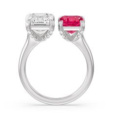 Consider this engagement ring if you're searching for a sentimental classic with a unique shine. This toi et moi engagement ring features a split shank where the two ends don't meet to form a complete circle. One end of the shank holds a bigger emerald-cut diamond while the other end holds a smaller Created Ruby emerald-cut. The two step-cut diamonds are beautifully set on a diamond-traced four-prong basket. Basket Engagement Ring, Gorgeous Engagement Ring, Ruby Emerald, Step Cut, Split Shank, Now And Forever, Ruby Gemstone, Emerald Cut Diamonds, Emerald Diamond