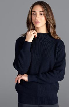 High mock turtleneck relaxed fit sweater  The Tamie sweater is a modern take on the classic fisherman knit style. The complementary raglan sleeve adds an extra touch of comfort and stitch detail across the shoulders. This versatile shape is defined by a ribbed trim detail. Made using super soft cotton and designed for a relaxed fit, the uniform half cardigan stitch is a joy to wear. Product Summary  100% cotton - a skin-friendly natural fibre Half cardigan stitch sweater High or stand neck Machi Biodegradable Clothing, Weekend Sweater, Half Cardigan, Rib Sweater, Stand Neck, Raglan Pullover, Grown Women, Mock Turtle, Knit Style