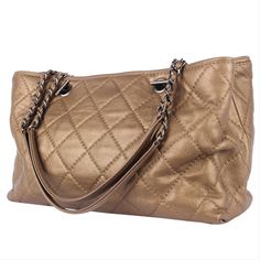 Authentic, pre-owned Classic Chanel Quilted Turn Lock CC Logo Caviar Leather Shoulder Bag. This is the perfect bag for all seasons. Features goldish brown quilted caviar leather, woven-in leather chain strap, CC-turn lock closure with ruthenium-finish metal hardware accents. Its turn-lock closure opens to a leather-lined interior with 2 compartment pockets, one middle zipper pocket, 3 side slip pockets. This is a timeless, classic piece only from Chanel. Authenticity Date Code: 20157567 Made in Gold Quilted Bag For Everyday Luxury, Classic Quilted Gold Bag, Classic Gold Quilted Bag, Luxury Quilted Gold Bag, Luxury Gold Quilted Bag, Designer Quilted Gold Bags, Gold Quilted Leather Shoulder Bag, Gold Quilted Travel Bag, Designer Quilted Gold Shoulder Bag