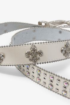 The Fleur Studded Rhinestone Belt is made from black leather and features intricate Western design motifs on the metal buckle, tip and loop, with rhinestone-embellished fleurs-de-lis and pearlescent rhinestones throughout. Design Details 100% leather metal buckle and trims S/M fits waists 32" - 36" M/L fits waists 36" - 40" Design Motifs, Rhinestone Belt, Western Design, Metal Buckles, Design Details, Black Leather, Buckle, Off White, Leather