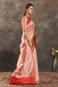 Be vision of elegance on special occasions in this traditional red silk saree. The saree is enhanced with overall heavy zari work. It comes with a matching blouse piece. Disclaimer: The shown stitched blouse on the model is for display purpose only. The saree comes with a matching blouse piece and finished with fall and piko. Elegant Red Pre-draped Saree For Puja, Red Tussar Silk Pre-draped Saree For Wedding, Red Raw Silk Pre-draped Saree For Traditional Ceremonies, Red Art Silk Blouse Piece For Formal Occasions, Transitional Red Banarasi Silk Pre-draped Saree, Formal Red Art Silk Blouse Piece, Red Paithani Silk Pre-draped Saree With Unstitched Blouse, Red Pre-draped Saree With Unstitched Blouse In Paithani Silk, Red Raw Silk Pre-draped Saree For Puja