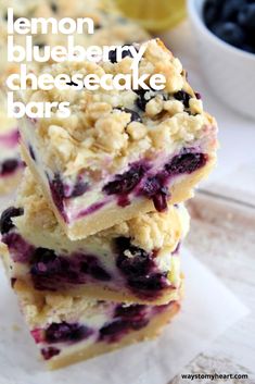 lemon blueberry cheesecake bars stacked on top of each other