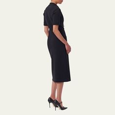 Carolina Herrera knit dress Notch lapels; double-breasted  Short sleeves Front patch pockets Sheath silhouette Midi length Hem falls below the knee Virgin wool/polyurethane/nylon/polyamide Made in Italy Luxury Short Sleeve Midi Dress For Work, Black Dress With Hidden Button Closure For Work, Office Midi Dress With Pockets, Fitted Midi Dress With Button Closure For Work, Structured Buttoned Dress For Work, Fitted Collared Midi Dress For Business, Structured Dress With Buttons For Work, Knee-length Office Dress With Hidden Button Closure, Office Knee-length Dresses With Hidden Button Closure