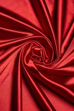 Discover the elegance of our Red Shiny Nylon Fabric, a luxurious material that exudes sophistication. Featuring a smooth, glossy finish that captures light beautifully, this satin effect fabric is perfect for crafting stunning evening dresses, chic bridal attire, and eye-catching formal garments. The bold red hue adds a dramatic flair, ensuring your creations make a statement at any special occasion or event. This fabric features a lustrous satin finish that adds an elegant touch to any garment! Bridal Attire, Nylon Fabric, Formal Attire, Dress Clothes For Women, Spandex Fabric, Stretchy Fabric, Satin Finish, Fabric Color, Bridal Gowns