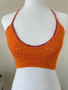 This custom/made to order, crochet backless bralette/cropped halter with a low-cut scoop neck, is versatile and will effortlessly transition from day to night. Pair it with your favourite jeans for a casual yet chic look, or dress it up a bit with a high waisted skirt for a more sophisticated ensemble. The timeless appeal of crochet makes this top a wardrobe staple that will never go out of style. Yarn always tends to stretch, so I typically recommend sizing down 1/2 size! Spring Festival Crop Top With Built-in Bra, Bohemian Halter Top With Built-in Bra, Bra-friendly Fitted Halter Top For Festivals, Festival Fitted Bra Friendly Halter Top, Festival Fitted Halter Top, Bra Friendly, Handmade Fitted Crop Halter Top, Handmade Fitted Halter Crop Top, Chic Fitted Crochet Top For Festival, Bohemian Fitted Halter Top With Built-in Bra