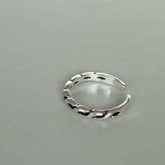 A sterling silver toe ring with twists.. 2mm wide. Weight: 0.95gm This is an open ended toe ring and can be adjusted to fit most feet. These toe rings are made of 925 hypoallergenic sterling silver. Comes with an oxidized finish. Please note this price is for ONE toe ring only. Sent in a gift box. I can include a personal message from you if needed You are welcome to contact me at... bhavnakwintra1956@gmail.com For more beautiful pieces from my shop, please browse 👇 TOE RINGS: https://www.etsy. Adjustable Silver Metal Toe Rings, Trendy Sterling Silver Toe Ring, Silver Open Ring Toe Rings, Silver Metal Open Toe Rings, Adjustable Silver Dainty Toe Rings, Dainty Adjustable Silver Toe Rings, Trendy Silver Toe Ring, Minimalist Silver Hypoallergenic Toe Rings, Minimalist Hypoallergenic Silver Toe Rings