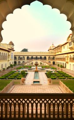 an ornate courtyard with a fountain in the middle