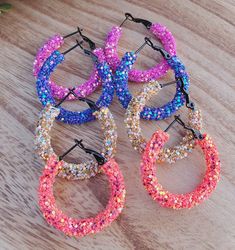 Beautiful Glitter Rope Hoop Earrings.  The Hoop is made of Stainless Steel. This listing is for ONE pair of Hoop Earrings.  Choose your color from the drop down.  They are about 1-1/4" in diameter.  Thank you for visiting my listing. Visit my store for more findings! Multicolor Hoop Earrings For Party, Multicolor Small Hoop Earrings For Party, Small Hoop Earrings For Party, Small Hoop Crystal Earrings For Party, Small Hoop Earrings For Party With Ear Wire, Rope Earrings, Clear Spring, Jewelry Earrings Dangle, Etsy Earrings