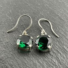 Vintage Deep Green Cubic Zirconia Sterling Silver Dangle Earrings, Stamped 925, Max Dangle Length 25.5mm, Diameter 11mm, Depth 5.8mm, Total Weight 2.85 Grams, Secure Ear Wire, Lovely Condition Sterling Silver Round Cut Earrings For May Birthstone, Classic Green Sterling Silver Earrings, Classic Nickel-free Dangle Crystal Earrings, Classic Round Crystal Earrings With Lever Back, Sterling Silver Crystal Earrings With Lever Back, Formal Hypoallergenic Sterling Silver Crystal Earrings, Hypoallergenic Sterling Silver Crystal Earrings For Formal Occasions, Classic Sterling Silver Crystal Earrings, Classic Sterling Silver Pierced Crystal Earrings