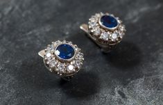 "Victorian Earrings set with a Created Sapphire in a flawless clarity & brilliant royal blue color in a 7mm (3 Carats for the pair), surrounded by high grade CZ Diamonds. Vintage Earrings design made of Solid 925 Sterling Silver ☞ made to last. Matching Ring: www.etsy.com/uk/listing/467023734 Matching Pendant: www.etsy.com/uk/listing/462931841 ⌛ Last pair left ⌛ For Pierced Ears - has a pin that goes into the ear and a leaver that securely closes on the pin behind the earlobes - \"English Lo Blue Clip-on Earrings For Anniversary, Blue Clip-on Earrings Fine Jewelry, Classic Blue Clip-on Jewelry, Royal Blue Earrings, Earrings Sapphire, Victorian Earrings, Earrings Design, Matching Ring, Victorian Design