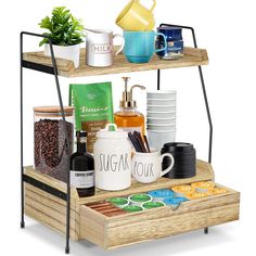 two tiered shelf with coffee cups, mugs and other items on it in front of a white background