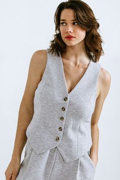 A ponti knit vest featuring V neckline, sleeveless and button down. Matching Bottom FP1013Details:Self : 55% Cotton 40% Polyester 5% SpandexSize & Fit- Model is 5`8" And Wearing Size Small- Measurements Taken From Size Small- Approx. Length: 21"e Vest And Pants Outfit, Vest And Pants, Heather Grey Sweatshirt, Kimono Sweater, Gray Sweatshirt, Flying Tomato, Skirt Jumpsuit, Matching Pants, Vest White